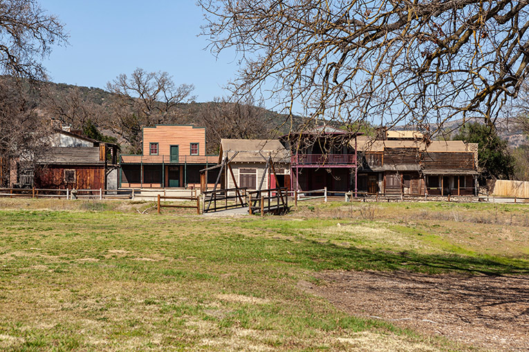 A sunny exterior shot of a small Western town set constructed in Agoura Hills.