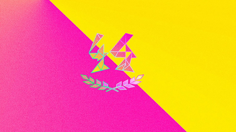 A banner diagonally painted yellow and pink. A stylized 44 in shades of pink and yellow above pink and yellow laurel branches.