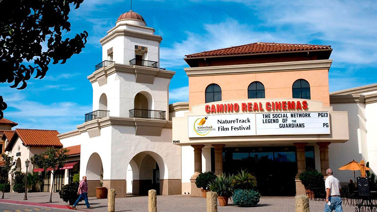 The exterior of the Camino Real Theater with the festival's name on the marquee.